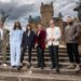 The final contestants of Celebrity Traitors standing with host Claudia Winkleman on the steps outside, posing together after the finale.