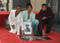 Letitia Wright, Simone Ledward Boseman and Michael B. Jordan kneel on Hollywood Walk of Fame, each with a hand on a new star