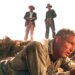 Three men standing over Luke in "Cool Hand Luke"