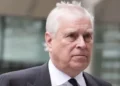 PA Media Andrew Mountbatten Windsor has grey hair. He is looking to the right. You can see the top of a suit and black tie.