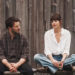 Dakota Johnson's Lucy Mason sits alongside Chris Evans' John Pitts in Materialists