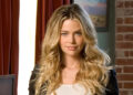 Denise Richards poses in a blazer.