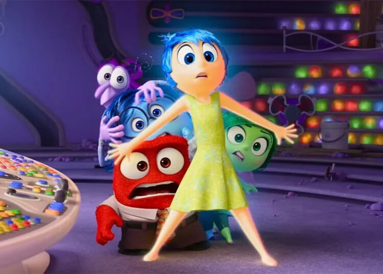 The characters of Inside Out cowering in terror, hiding behind Joy.
