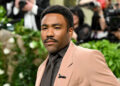 Donald Glover wears brown suit at Met Gala.