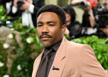 Donald Glover wears brown suit at Met Gala.