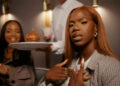 Enny in a still from the music video for her new single, "Selfridges".