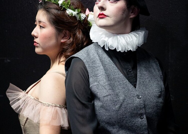Chihiro Nakazaki (left) plays Ophelia opposite Ashleigh Mathews as Hamlet at the University of Central Arkansas.
(Special to the Democrat-Gazette)