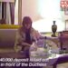 A screengrab of a video showing Sarah Ferguson sitting on a couch in a hotel room. There is text imposed on the screen.