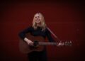 Musciain Jeri Katherine Howell plays acoustic guitar on her new solo album, Woman.