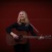 Musciain Jeri Katherine Howell plays acoustic guitar on her new solo album, Woman.