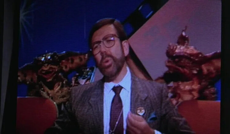 Loenard Maltin about to be killed by Gremlins in Gremlins 2: The New Batch
