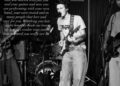 A black and white photo of Cruz Beckham performing on stage