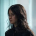 Anya Chalotra's Yennefer stands against a blurred background in The Witcher