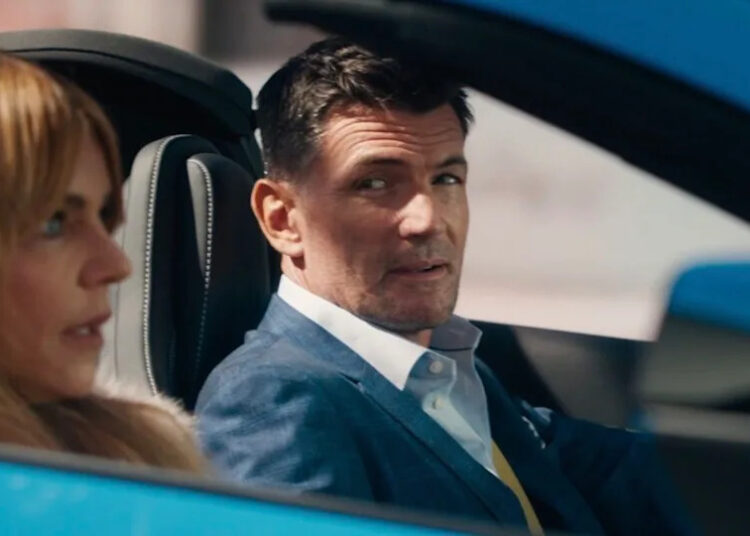 Turner looking at Morgan while driving in High Potential Season 2 winter finale.