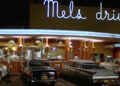 Neon lights illuminated Mel's Drive-in in American Grafitti