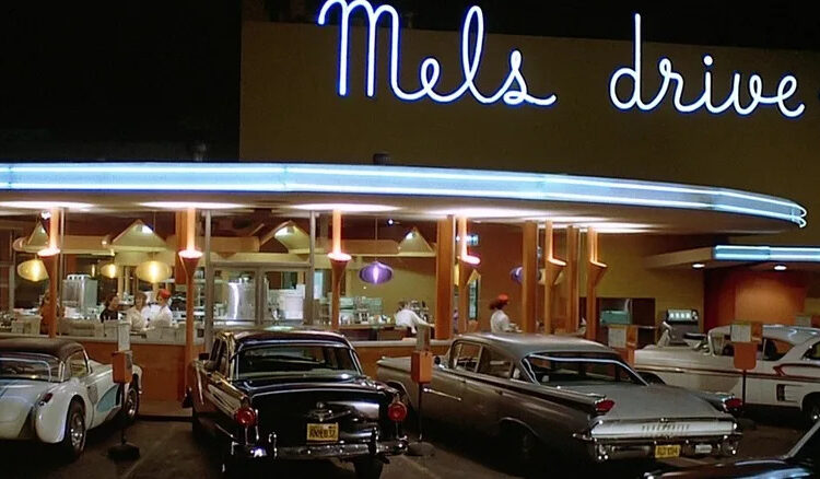 Neon lights illuminated Mel's Drive-in in American Grafitti