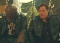 Brendan Fraser as Cliff Steele sitting next to Robot Man in Doom Patrol