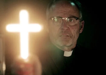 Father Callahan waving a glowing cross in 'Salem's Lot