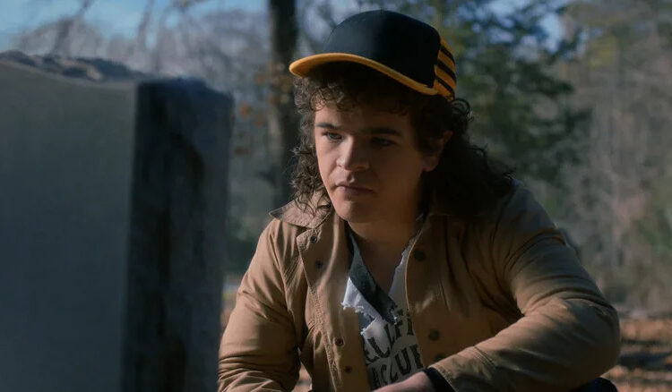 Dustin looking at Eddie's grave in Stranger Things