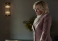Dina smiling at someone in an office on All's Fair