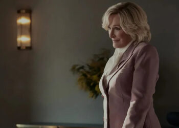 Dina smiling at someone in an office on All's Fair