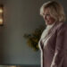 Dina smiling at someone in an office on All's Fair