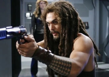 Dex aims a gun on the ship in Stargate: Atlantis
