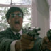 Chow Yun-fat as Ken "Gor" Lee roars while firing off two handguns in A Better Tomorrow II