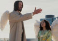 Gabriel gesturing in front of Martha in Good Fortune