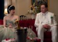 A nervous man in a white suit plays a role at a Japanese wedding.