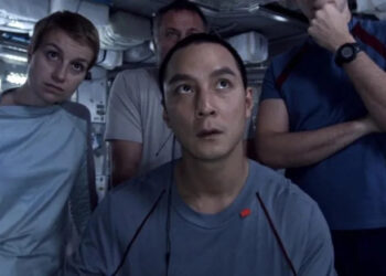 Anamaria Marinca, Daniel Wu, Michael Nyqvist and Sharlto Copley looking at a monitor in Europa Report
