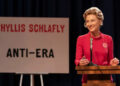 Phyllis Schlafly (Cate Blanchett) in front of a sign against the ERA on Mrs. America