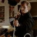 Denis Leary looking angry while on the phone and spraying water from a sink in The Ref.