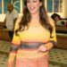 Kelly Brook arrives in Australia for I’m A Celebrity… Get Me Out of Here! wearing a yellow-and-orange Louisa Ballou dress, looking glamorous as she steps off the plane.