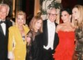 Kris Jenner looked like the ultimate Bond girl as she brandished a pistol at her 007-themed birthday party.