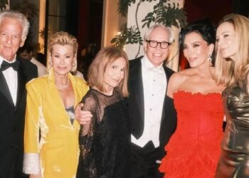 Kris Jenner looked like the ultimate Bond girl as she brandished a pistol at her 007-themed birthday party.