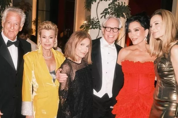 Kris Jenner looked like the ultimate Bond girl as she brandished a pistol at her 007-themed birthday party.