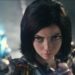 Rosa Salazar looks up defiantly while holding her sword skyward in Alita: Battle Angel.