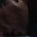 Barry Keoghan's Oliver Quick lays his head on the floor of a bathtub in Saltburn