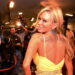 Jenna Jameson wears a yellow dress at a movie premiere