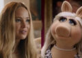 Side by side: Maddie talking to Percy's parents in No Hard Feelings; Miss Piggy talking to Kermit in The Muppets.