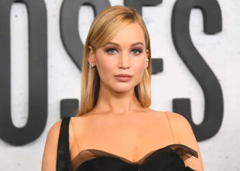 Jennifer Lawrence wears a black dress to a movie premiere