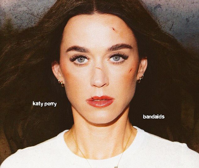Katy Perry has left fans reeling after unveiling a dark, bruised-up new look to promote her upcoming single Band-Aid