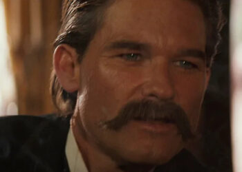 Kurt Russell as Wyatt Earp looking worried in Tombstone
