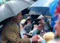 PA Media King meeting crowds in the rain in Merthyr Tydfil