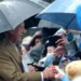 PA Media King meeting crowds in the rain in Merthyr Tydfil