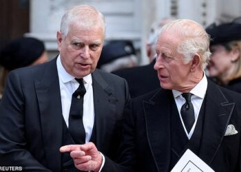FILE PHOTO: Britain's Prince Andrew speaks with King Charles as they leave Westminster Cathedral at the end of the Requiem Mass, on the day of the funeral of Britain's Katharine, Duchess of Kent, in London, Britain, September 16, 2025