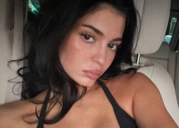 Kylie Jenner pouts at the camera in low cut top