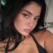 Kylie Jenner pouts at the camera in low cut top