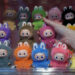A person holds a PopMart Labubu The Monsters Big into Energy Series Vinyl Plush dolls during a press preview at an AliExpress pop-up store on Nov. 11, 2025.